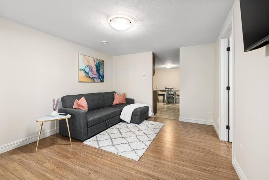 a living room with a couch and a table at Quite 1 bedroom apartment. in Dieppe
