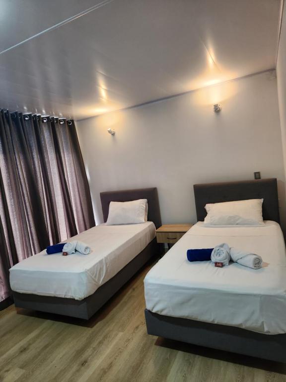 Ένα ή περισσότερα κρεβάτια σε δωμάτιο στο Hotel nelumbo