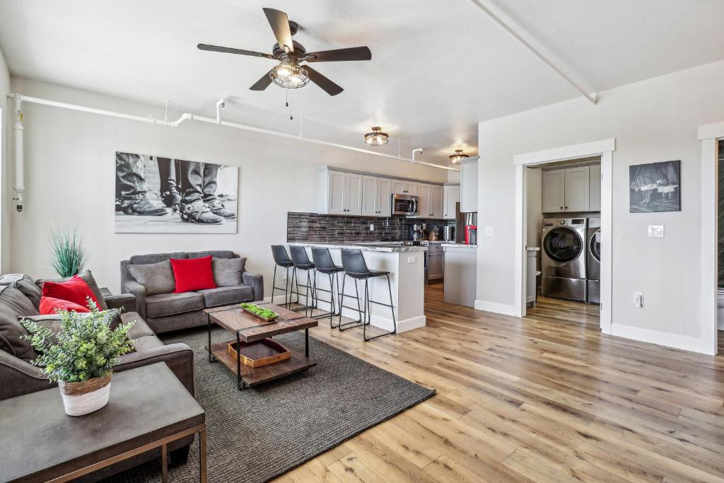 a living room with a couch and a ceiling fan at Stylish Virginia City Apartment with Deck! in Virginia City