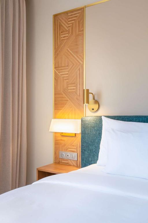 Postel nebo postele na pokoji v ubytování Radisson Hotel Saint Denis, La Reunion