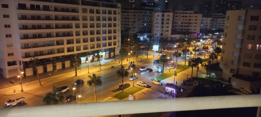 a view of a city street at night at مالاباطة in Tangier