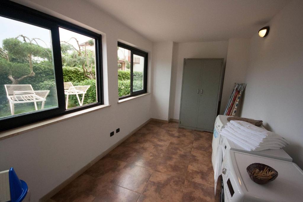 Łóżko lub łóżka w pokoju w obiekcie Della Piana Residence