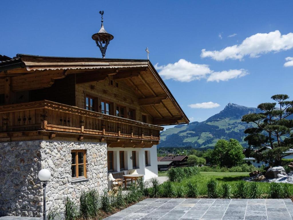 a building with a balcony on top of it at Kitz Boutique Chalet am Lift in Kirchberg in Tirol