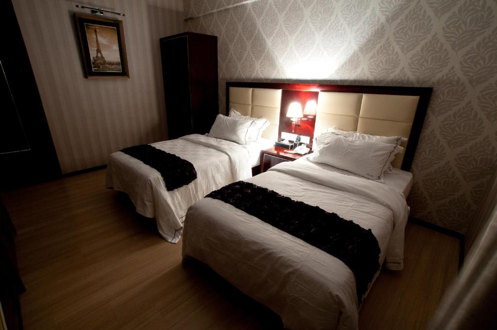 Postel nebo postele na pokoji v ubytování Pariss Hotel