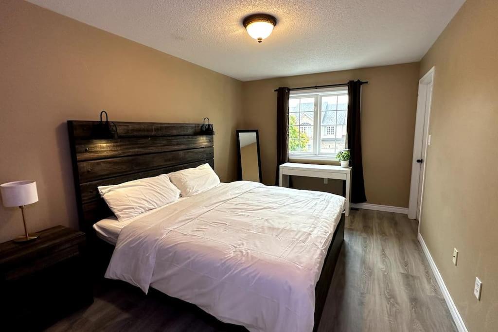 a bedroom with a large bed and a window at No available not in Welland