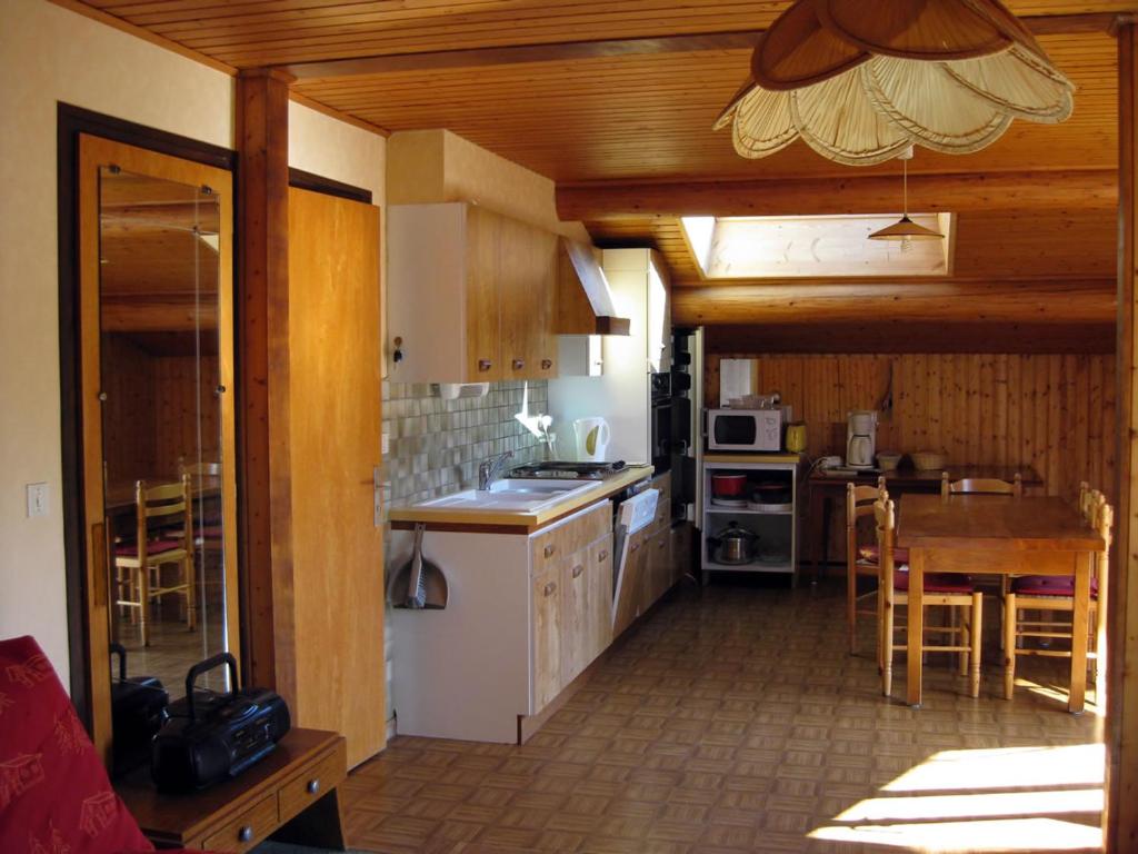 a kitchen with a sink and a counter top at Chalet Le Grand-Bornand, 7 pièces, 12 personnes - FR-1-467-121 in Le Grand-Bornand