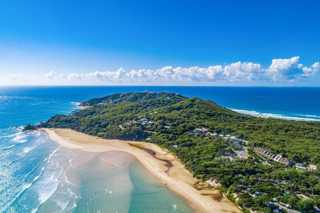 an aerial view of a beach and the ocean at A Perfect Stay - 4 James Cook Apartments in Byron Bay