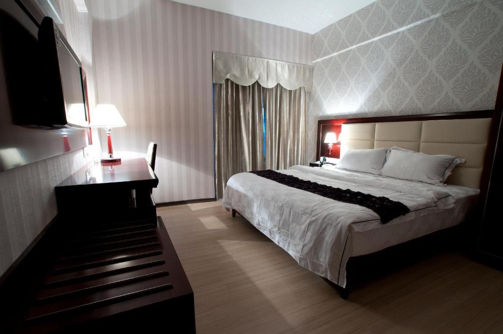 Postel nebo postele na pokoji v ubytování Pariss Hotel