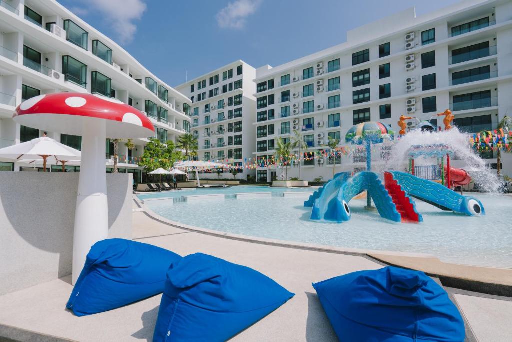 a water park with a water slide in a pool at Wyndham La Vita Rawai Phuket in Rawai Beach