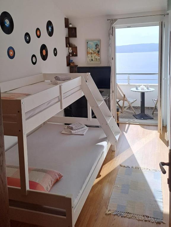 Posteľ alebo postele v izbe v ubytovaní Kuća za odmor Leptirić