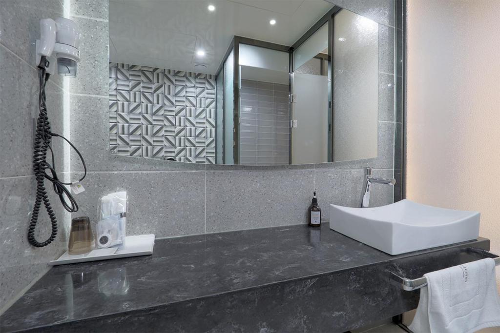 Koupelna v ubytování HOTEL YUNA Business