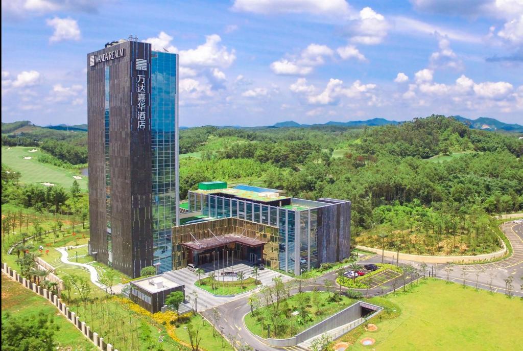 an aerial view of a tall building with a garden at Wanda Realm Heshan in Jiangmen