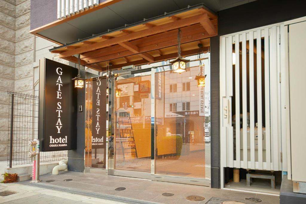 a store front of a building with a glass door at GATE STAY hotel Osaka Namba in Osaka