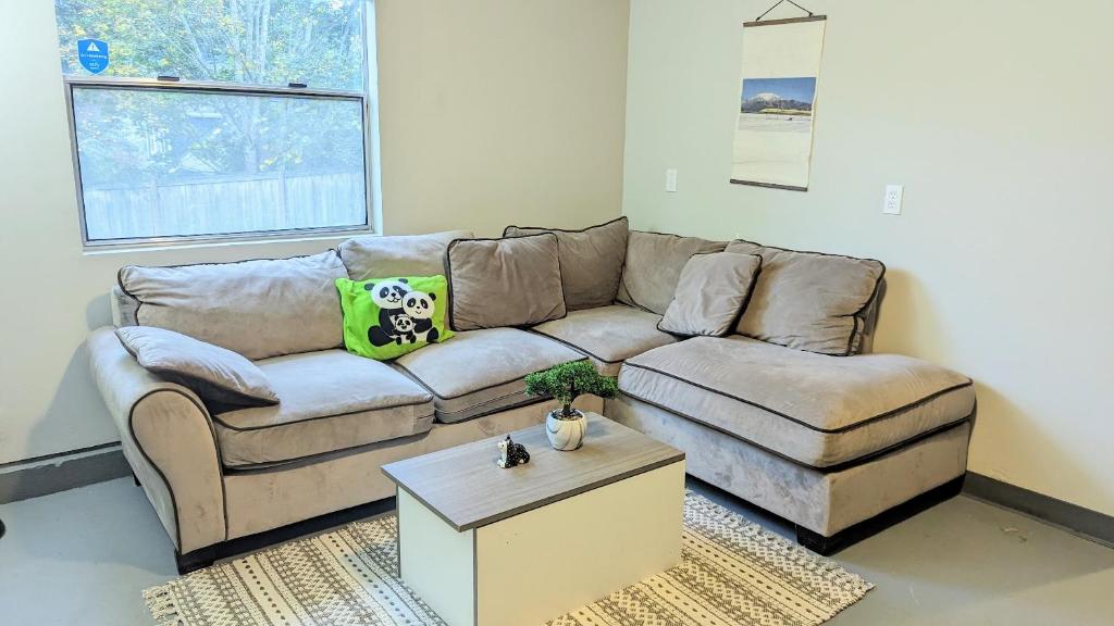 a living room with a couch and a coffee table at Private Suite with own entrance in Bellevue