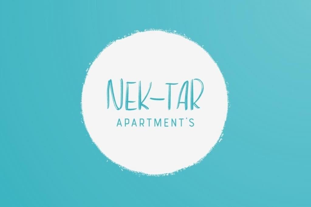 a white circle with the words new tax application requirements at Nektar-apartments in Piraeus