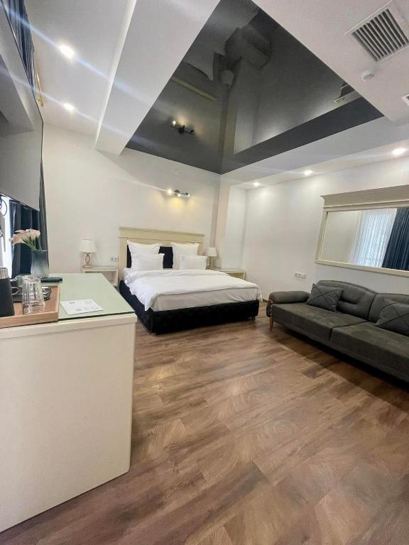 Postel nebo postele na pokoji v ubytování Wald Hotel Lagodekhi Rooms