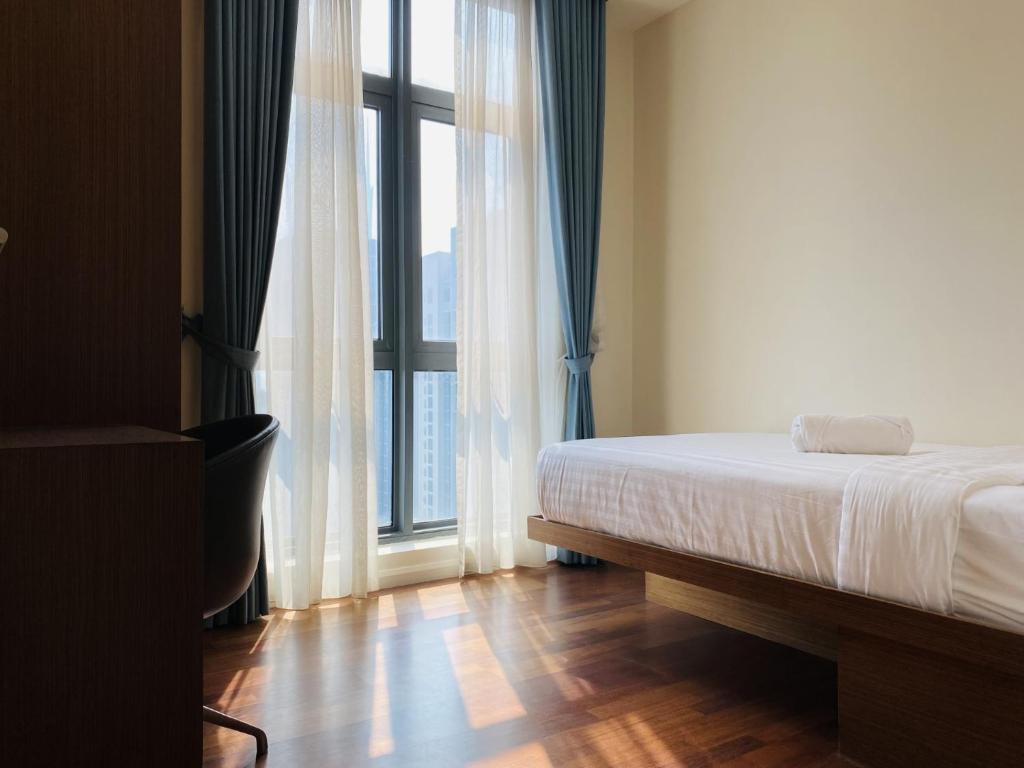 Postel nebo postele na pokoji v ubytování Tribeca Serviced Hotel by Millennium