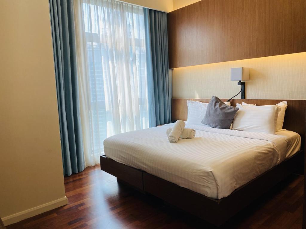 Postel nebo postele na pokoji v ubytování Tribeca Serviced Hotel by Millennium