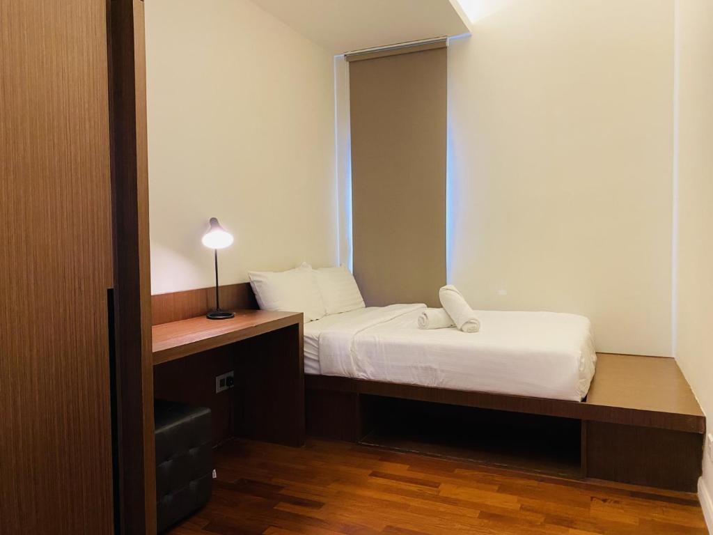 Postel nebo postele na pokoji v ubytování Tribeca Serviced Hotel by Millennium