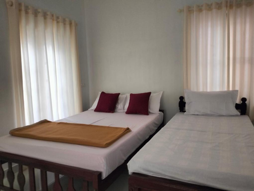 Letto o letti in una camera di Guestland Homestay