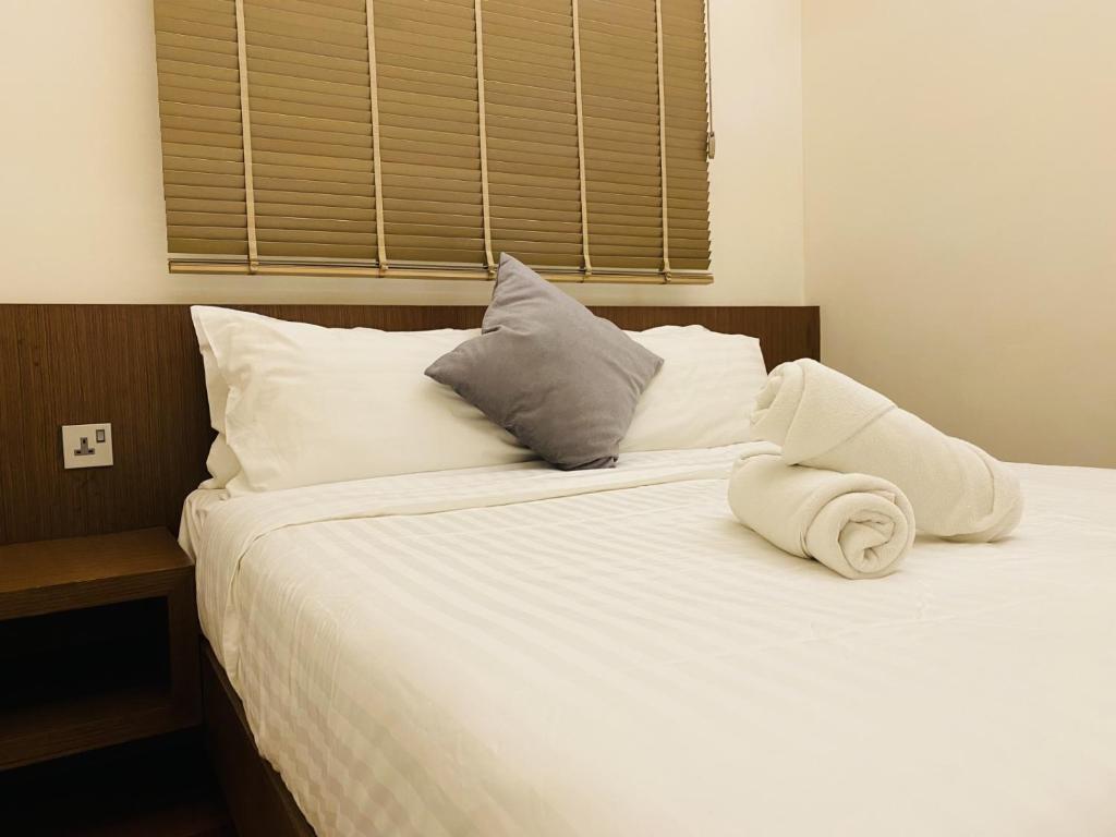 Postel nebo postele na pokoji v ubytování Tribeca Serviced Hotel by Millennium