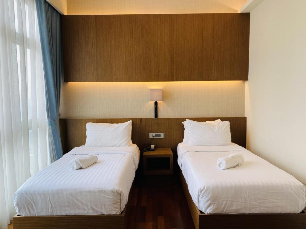 Postel nebo postele na pokoji v ubytování Tribeca Serviced Hotel by Millennium