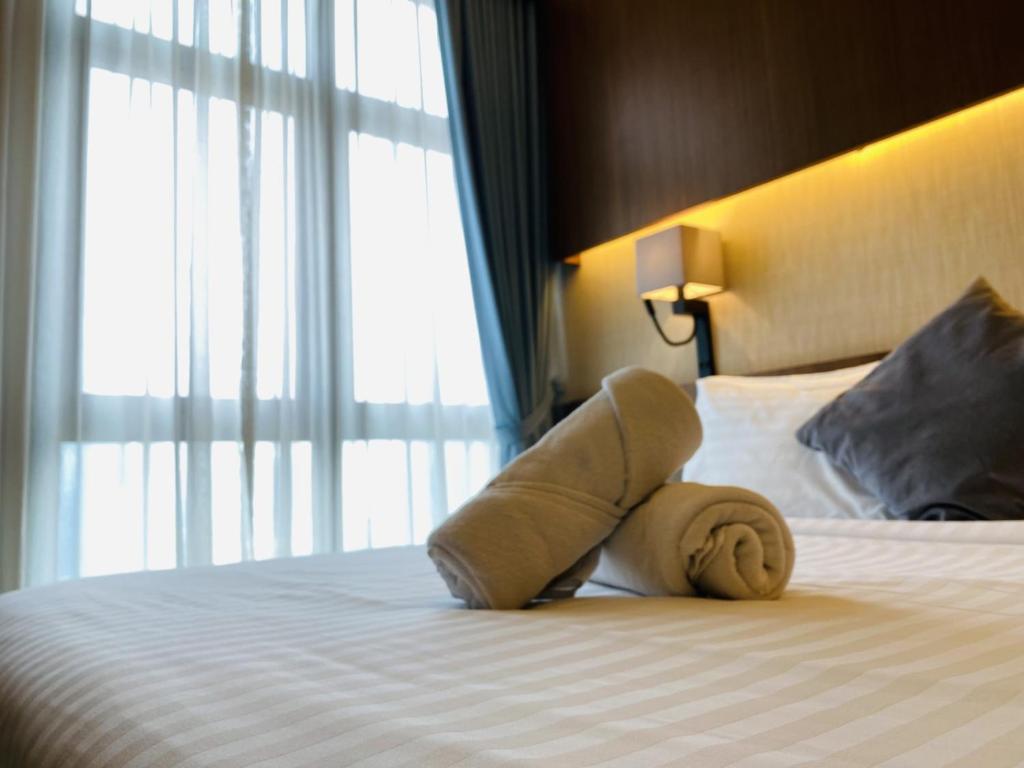 Postel nebo postele na pokoji v ubytování Tribeca Serviced Hotel by Millennium