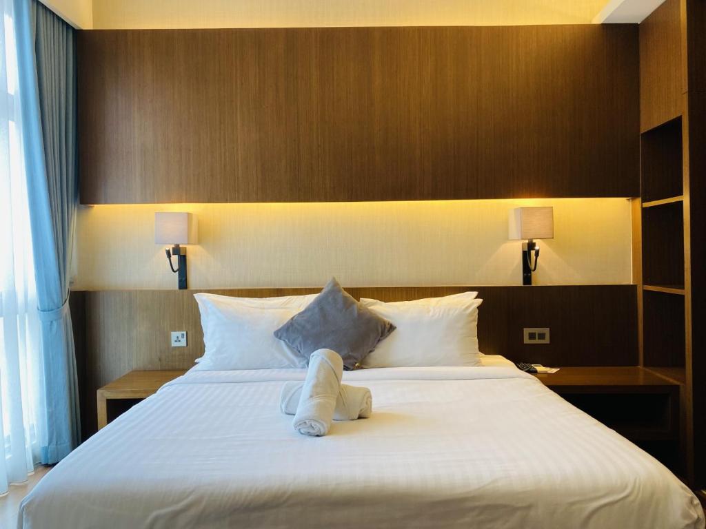 Postel nebo postele na pokoji v ubytování Tribeca Serviced Hotel by Millennium