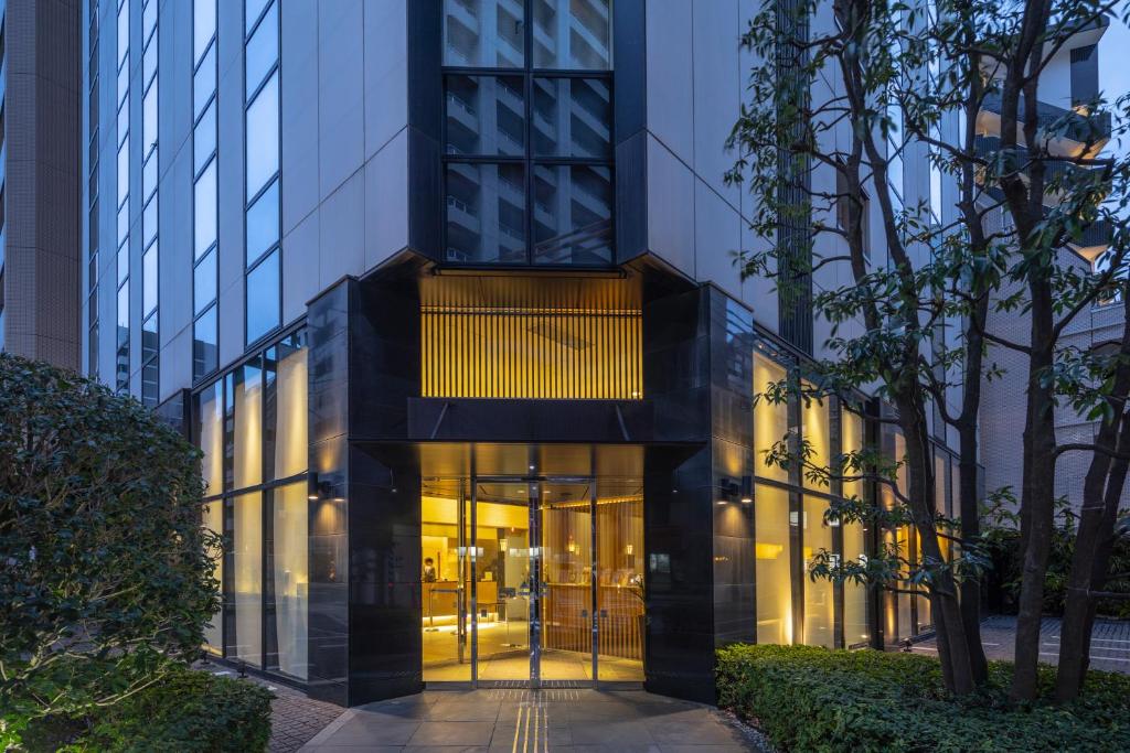 an entrance to a building with glass doors at Tokyu Stay Kamata - Tokyo Haneda in Tokyo