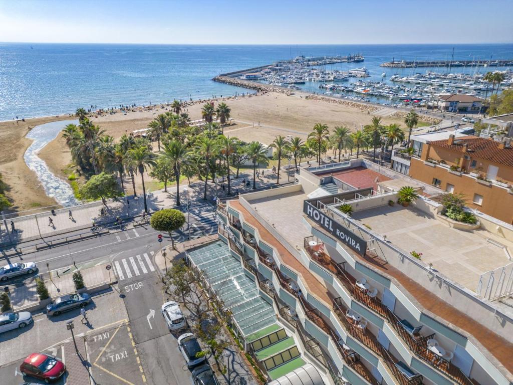 an aerial view of a city with a beach at Hotel Rovira in Cambrils