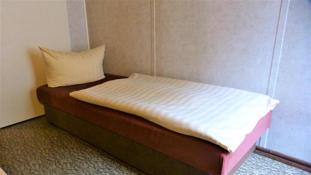 Postel nebo postele na pokoji v ubytování Bungalow MEER ODER WENIGER direkt am Strand