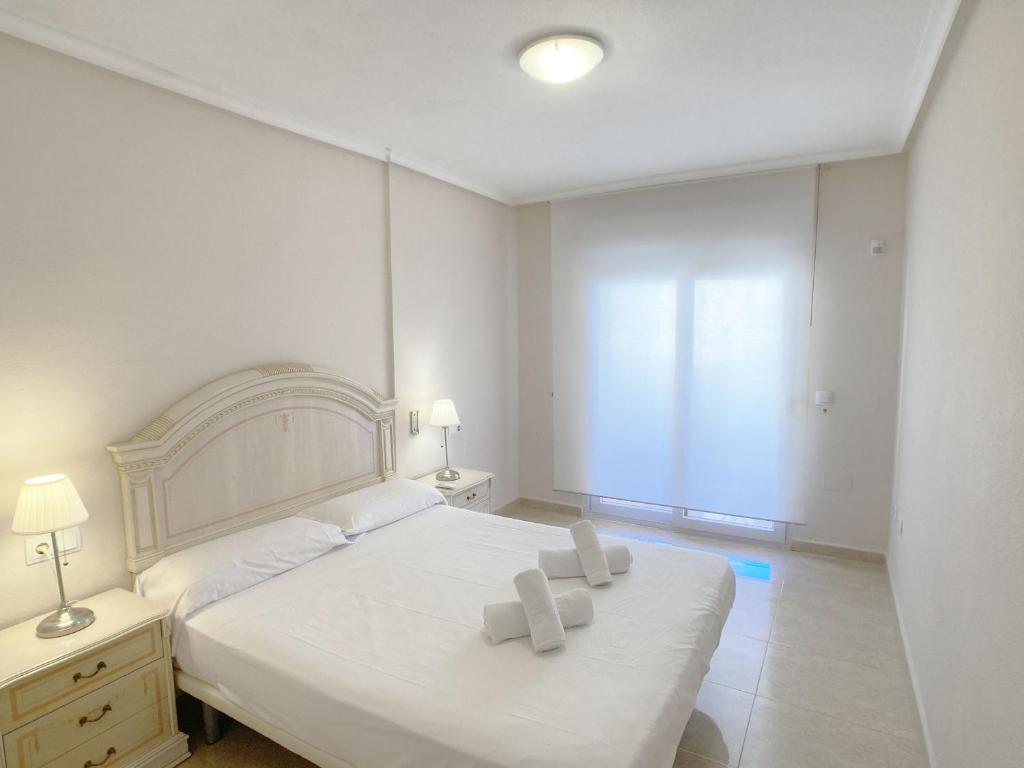 A bed or beds in a room at Spanish Connection - Playa Principe