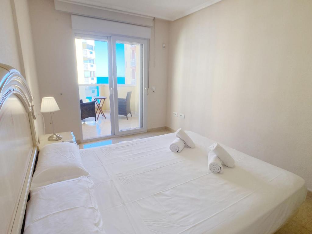 A bed or beds in a room at Spanish Connection - Playa Principe