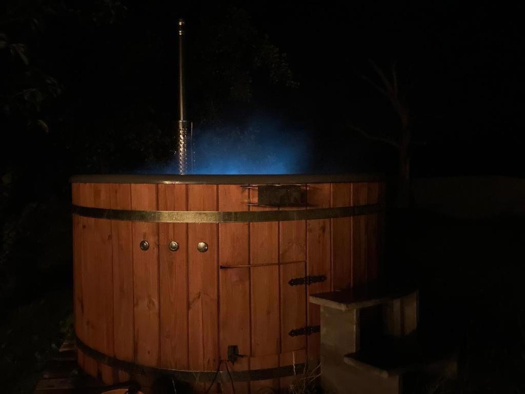 a barrel with smoke coming out of it at night at Nowoczesny mały Apartament nr 3 nad jeziorem in Orzysz