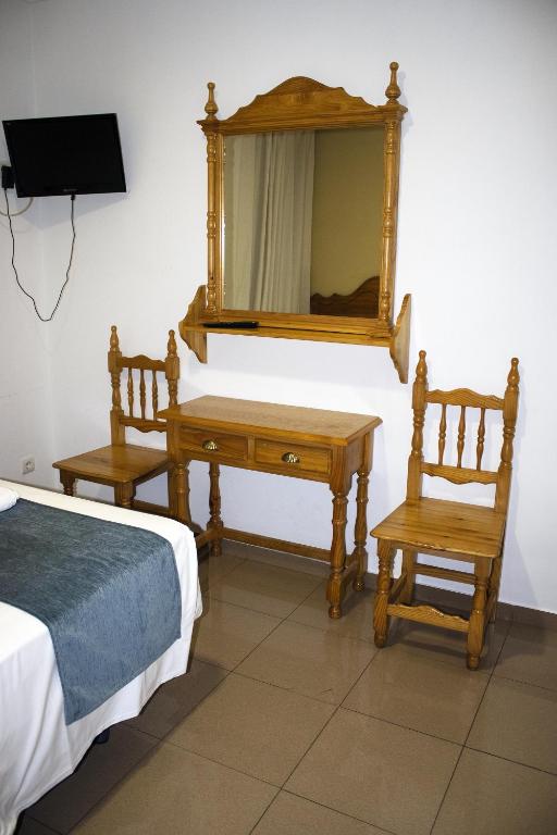 Posteľ alebo postele v izbe v ubytovaní Hostal Valdepeñas by Bossh Hotels
