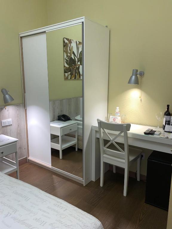 Postel nebo postele na pokoji v ubytování Frapolli Hotel on Deribasivska street
