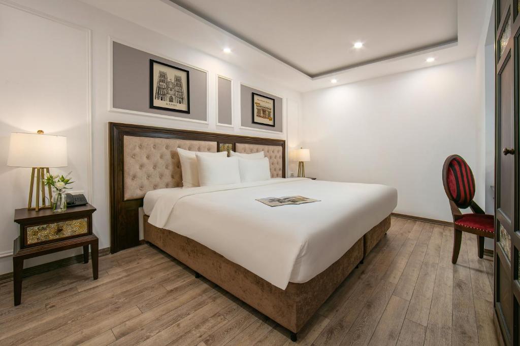 Postel nebo postele na pokoji v ubytování Gloud Hotel