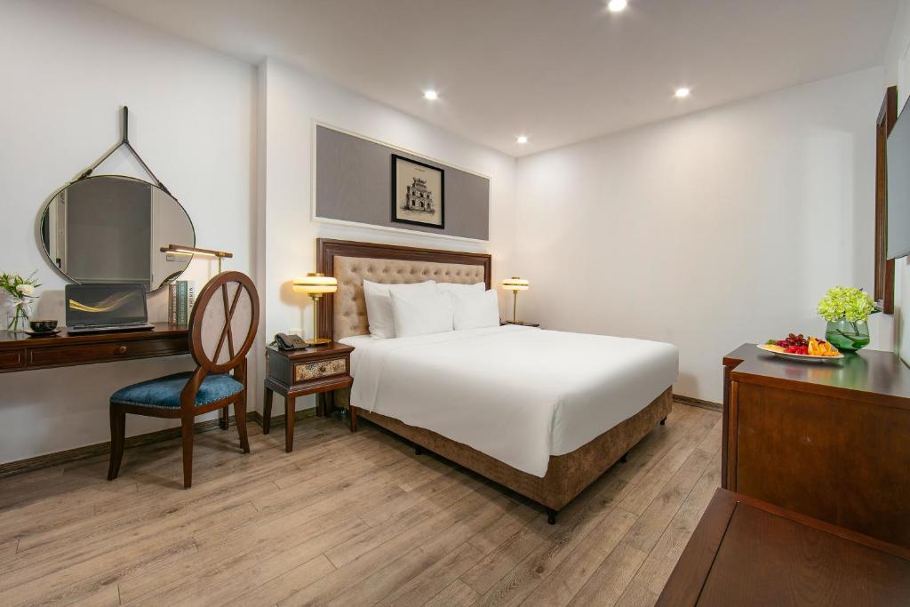 Postel nebo postele na pokoji v ubytování Gloud Hotel