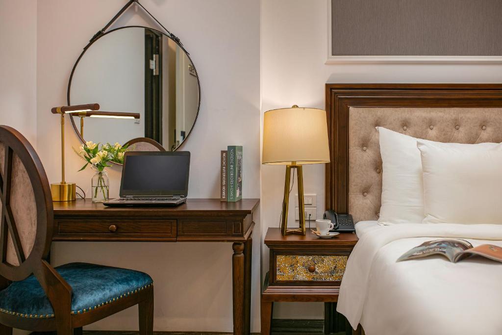 Postel nebo postele na pokoji v ubytování Gloud Hotel