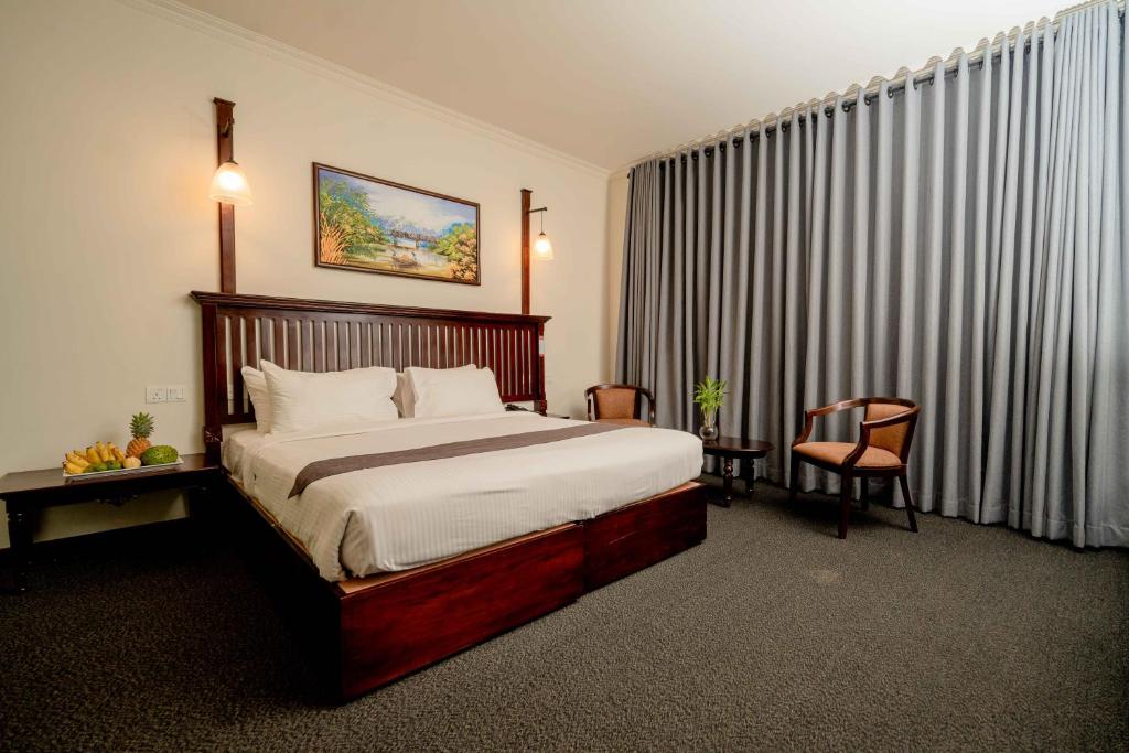 Postel nebo postele na pokoji v ubytování Hotel Nippon Colombo