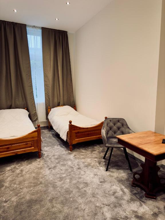Posteľ alebo postele v izbe v ubytovaní Apartamenty Grodzka 8