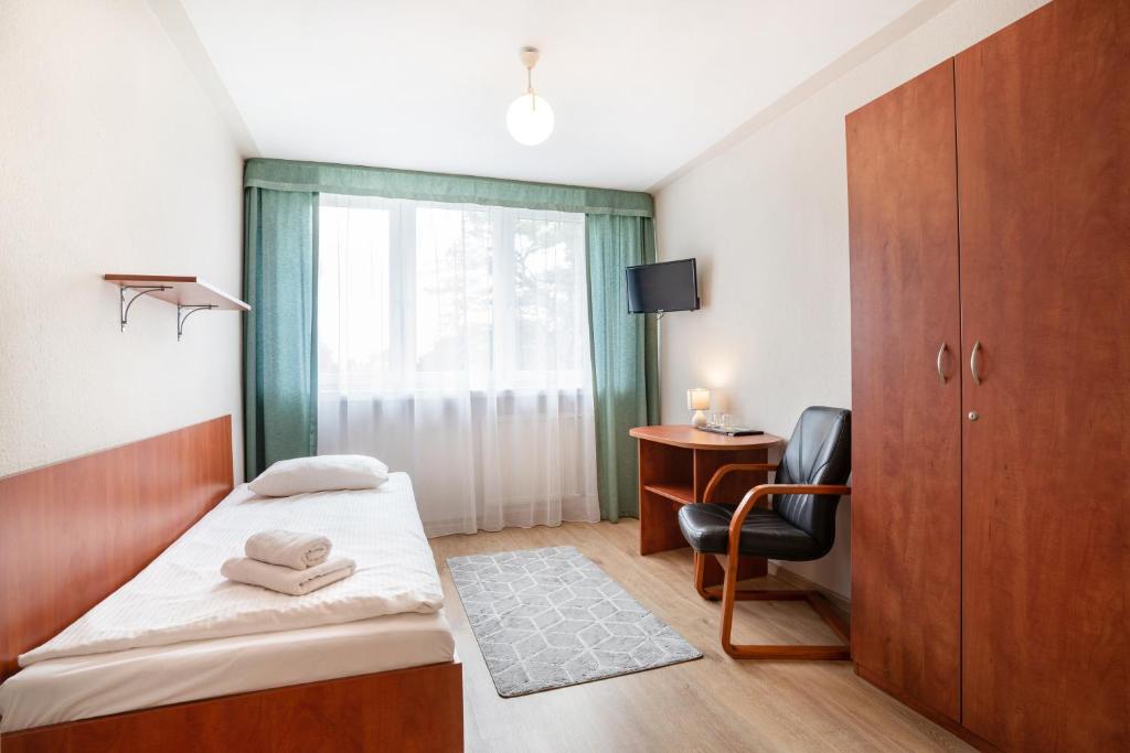 Posteľ alebo postele v izbe v ubytovaní Hotel Alf