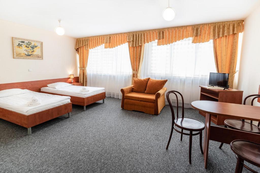 Posteľ alebo postele v izbe v ubytovaní Hotel Alf