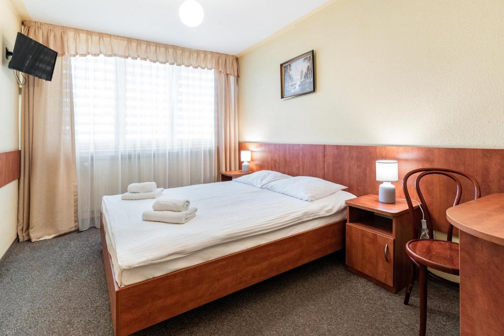 Posteľ alebo postele v izbe v ubytovaní Hotel Alf