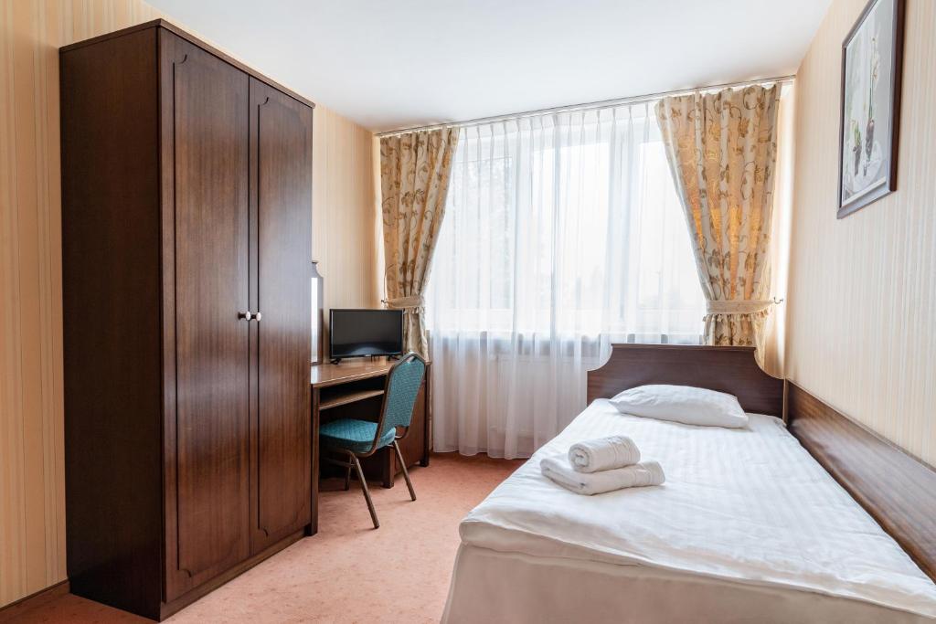 Posteľ alebo postele v izbe v ubytovaní Hotel Alf