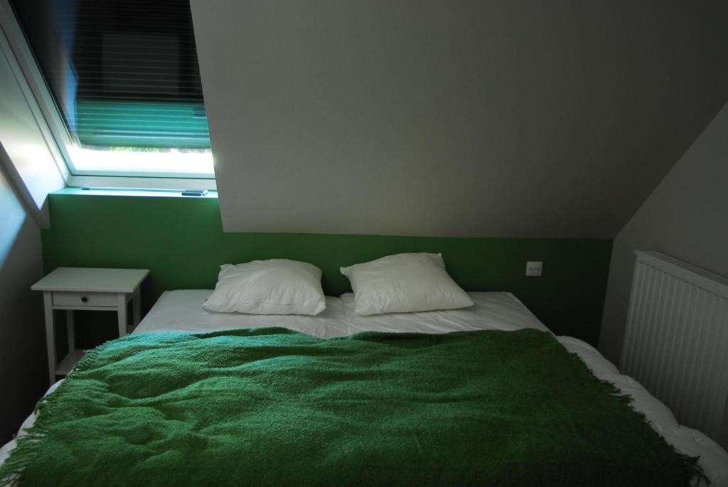 Postel nebo postele na pokoji v ubytování B&B Het Schaliënhof