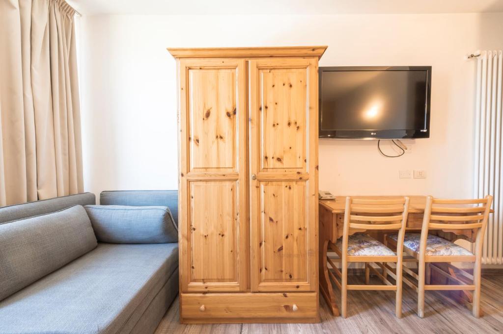 TV a/nebo společenská místnost v ubytování Hotel Vescovi