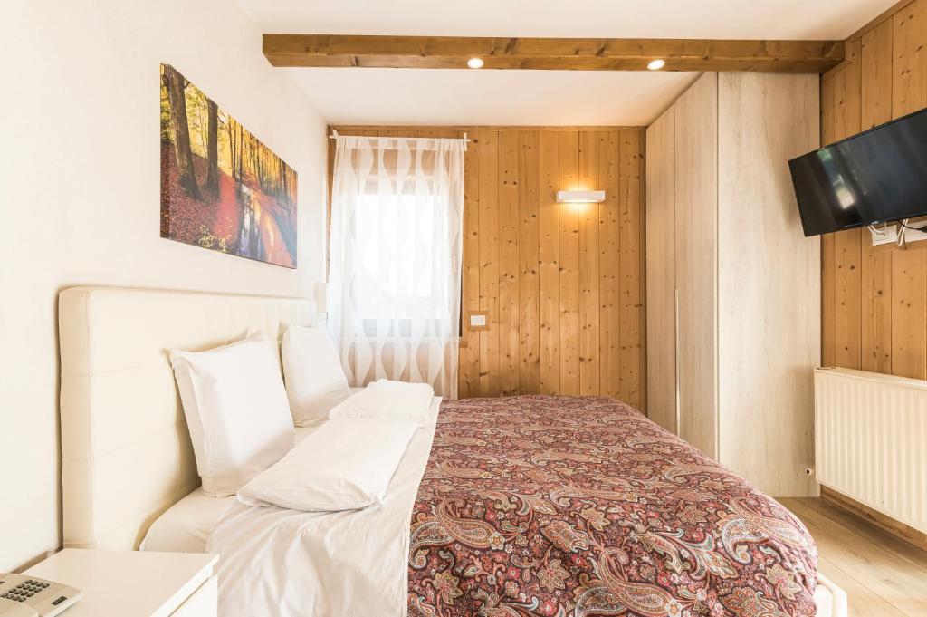 Postel nebo postele na pokoji v ubytování Hotel Vescovi