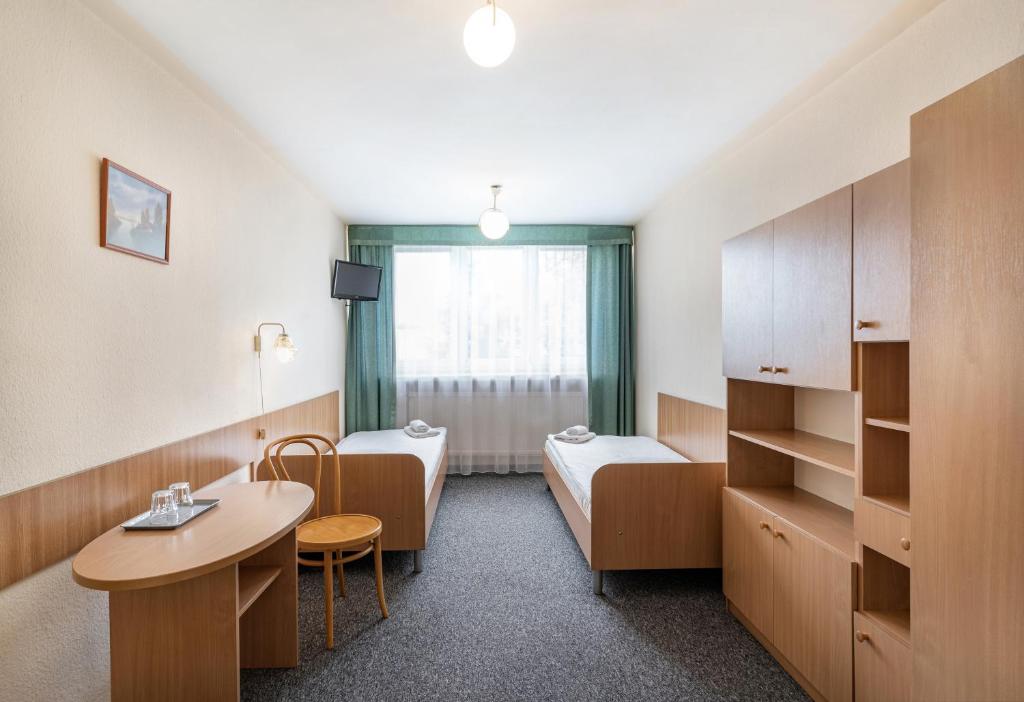 Posteľ alebo postele v izbe v ubytovaní Hotel Alf