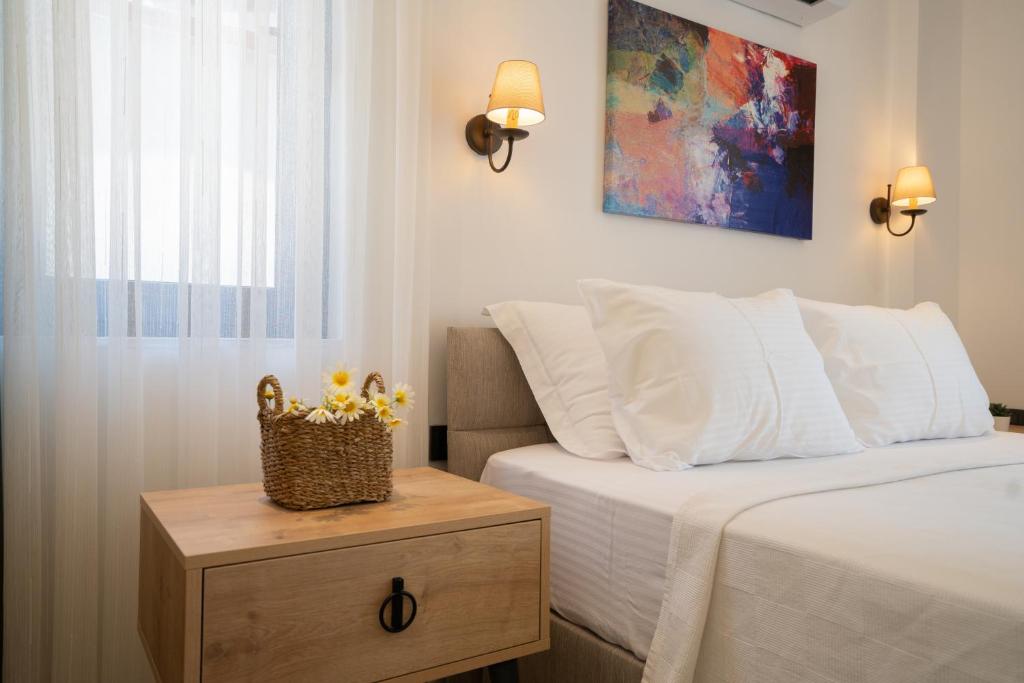 Postel nebo postele na pokoji v ubytování KAYA APARTMENTS